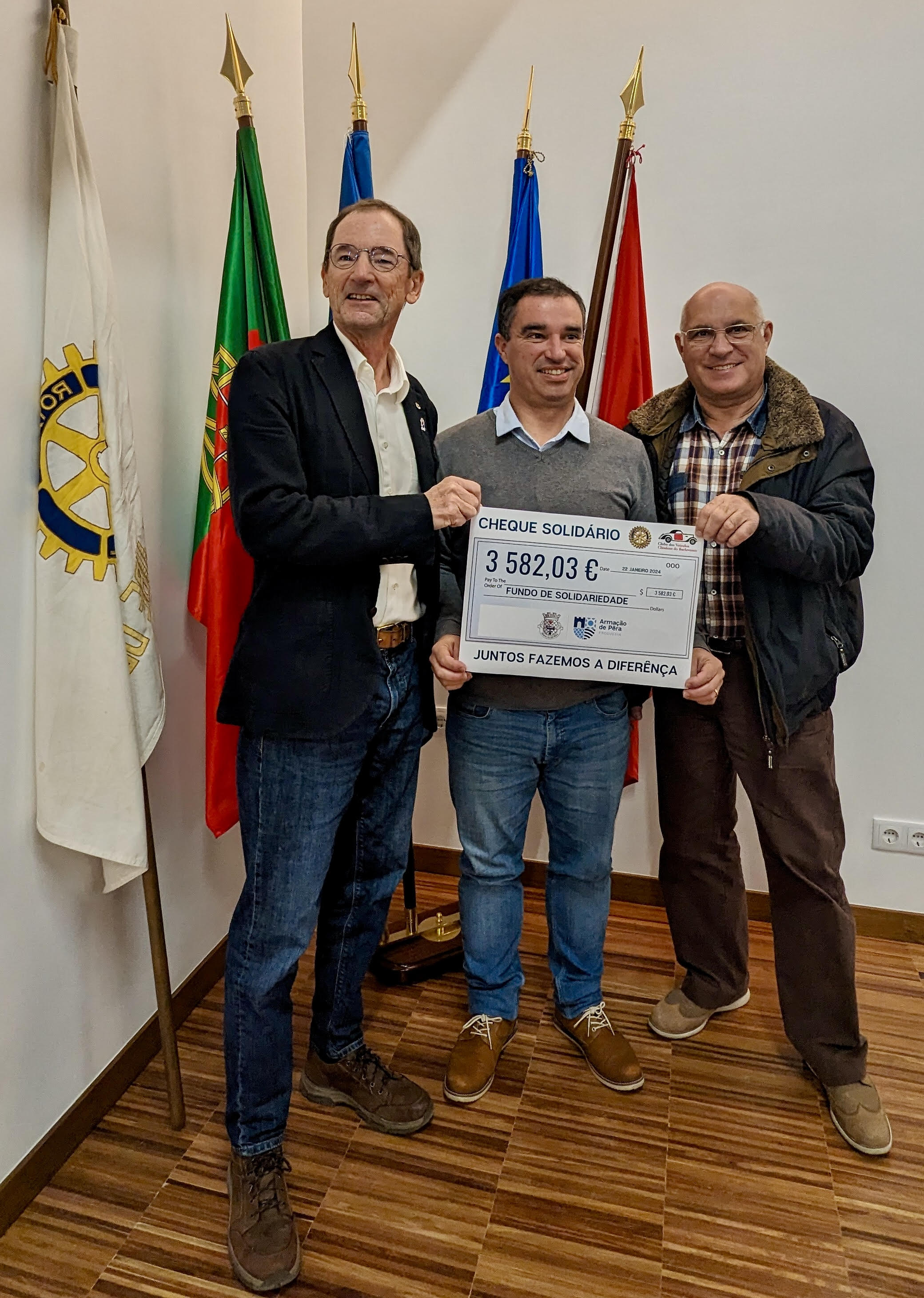 Handing over the cheque